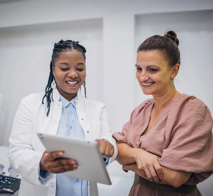 Doctor and patient discussing medical results on an iPad