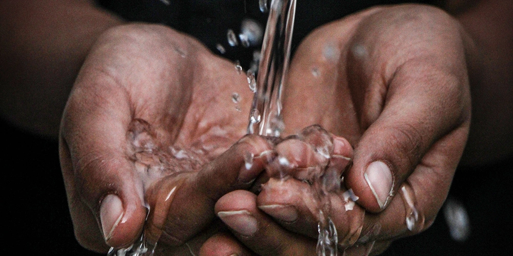 Hands holding water