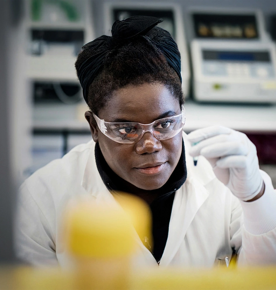 Research scientist in a lab looking at a sample