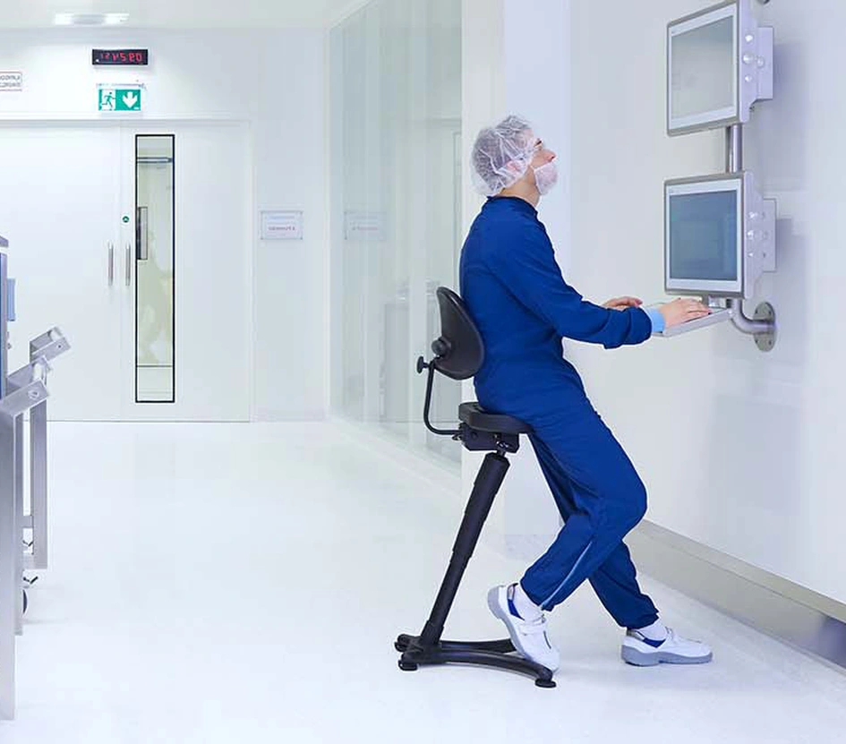 Production specialist working on a computer