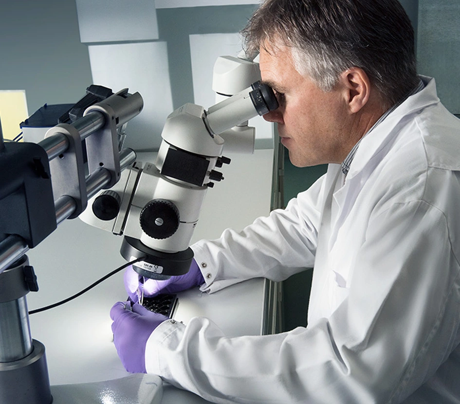 Scientist with microscope