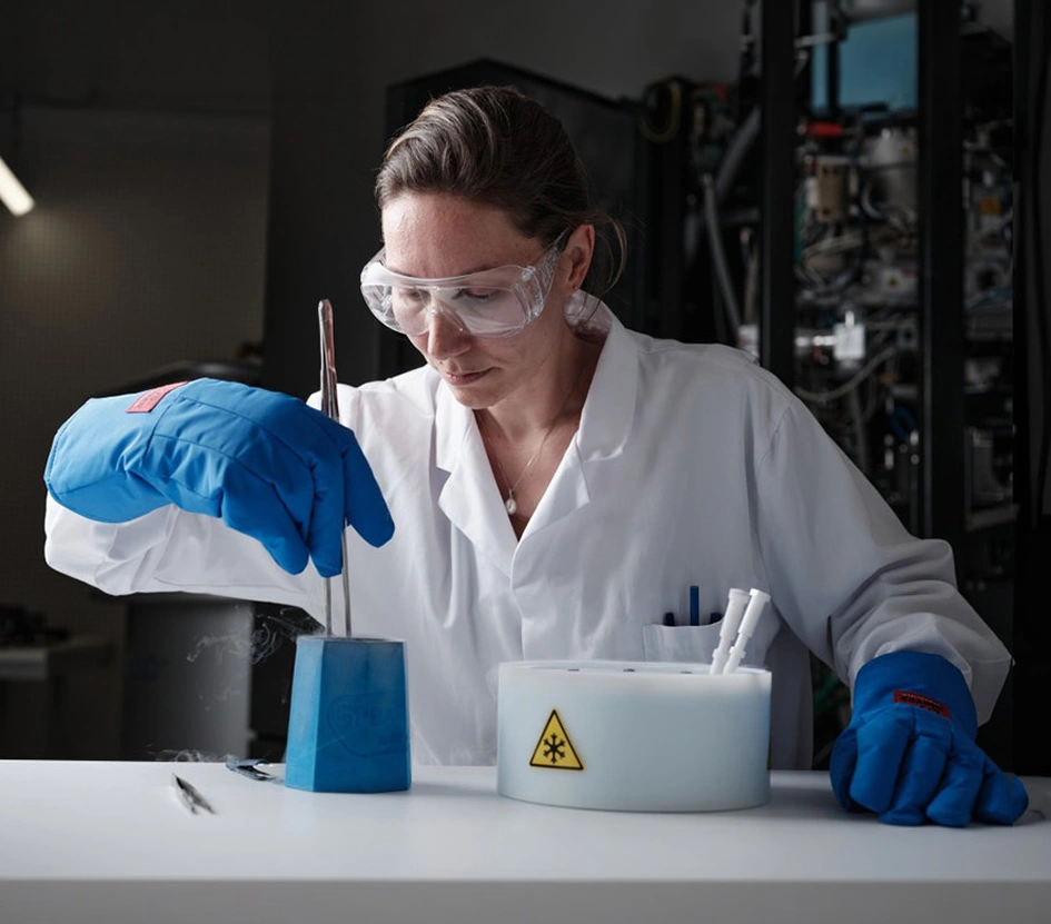 Scientists working in a laboratory with protective gear