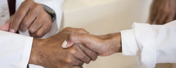 Two doctors shaking hands