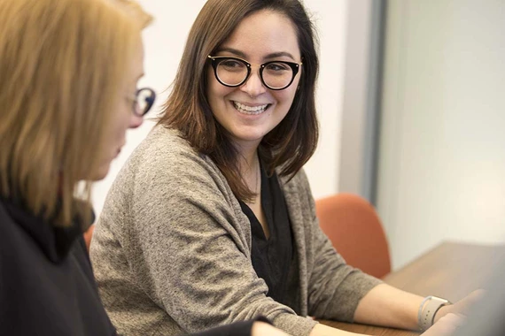 Two women discussing during a training